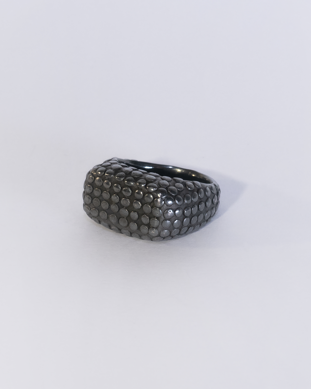Black wide heavy silver ring with polished flat nubs surface