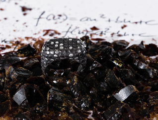 Black wide heavy silver ring with polished flat nubs surface, you can see some silver spots