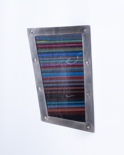 Irregular angular brooch with a silver frame and canvas in colourful fine stripes, it looks like a framed picture